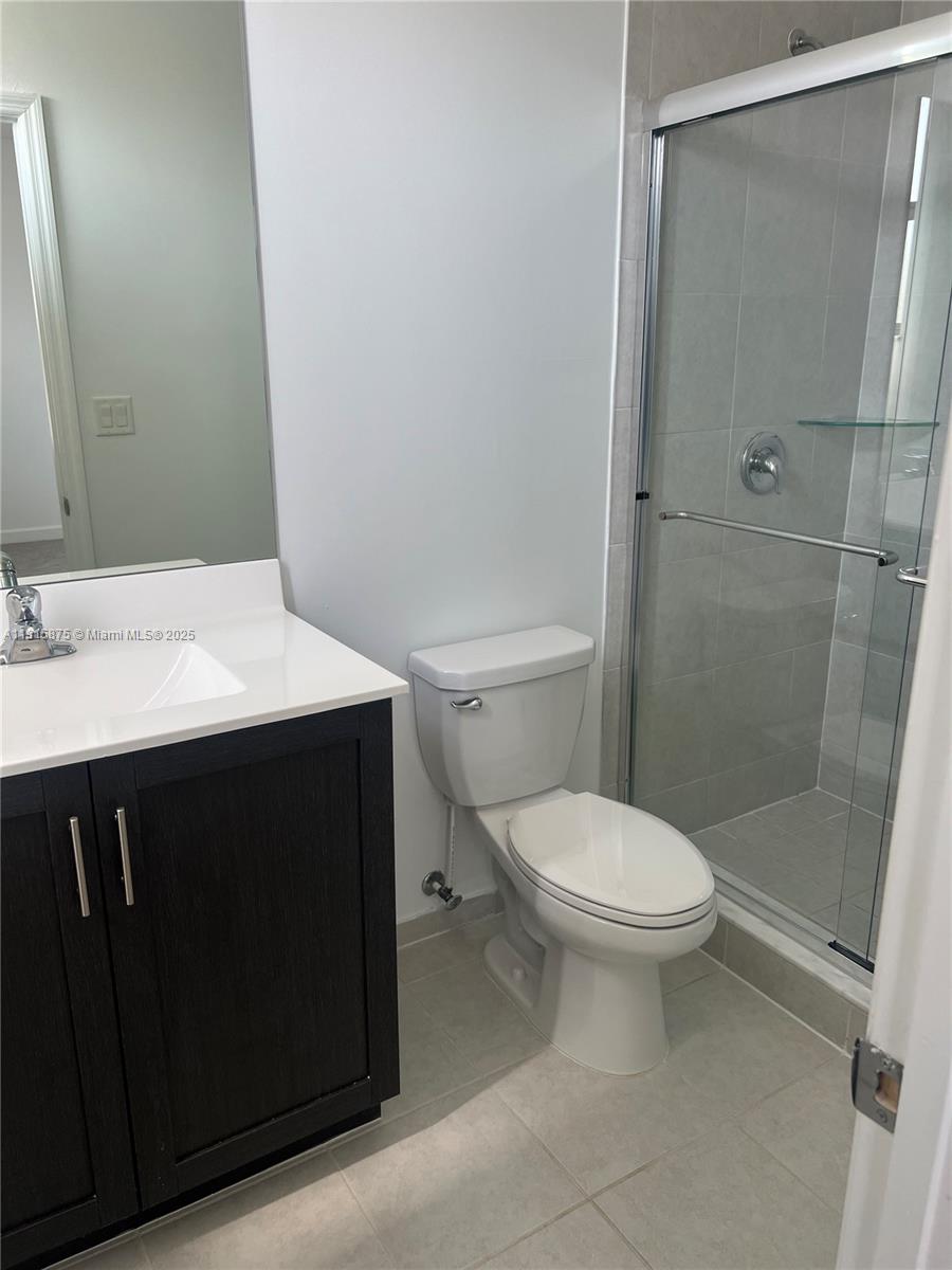 28701 Southwest 132nd Place Homestead, FL 33033 - Photo 14 of 17 a bathroom with a sink a toilet and shower