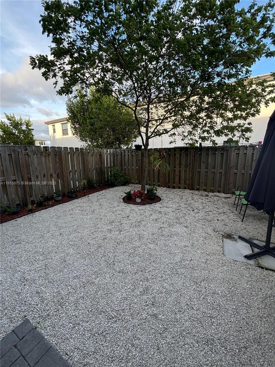 28701 Southwest 132nd Place Homestead, FL 33033 - Photo 17 of 17 a view of a backyard with furniture