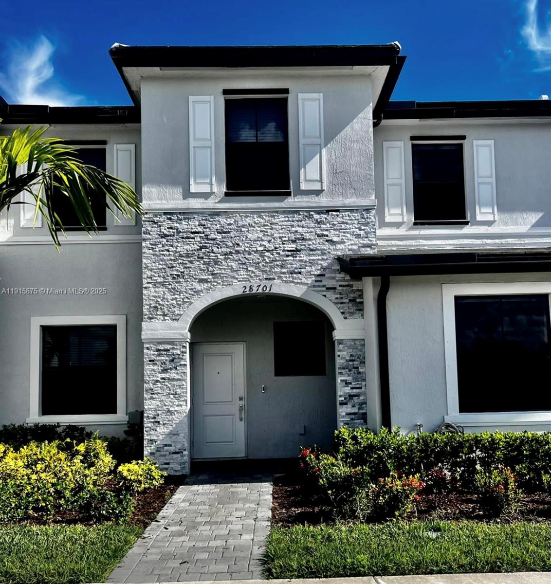 28701 Southwest 132nd Place Homestead, FL 33033 - Photo 2 of 17 a front view of a house with lots of yellow lighting