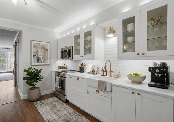 a kitchen with a sink and cabinets