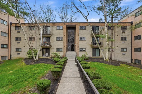 a view of a front of a house with a yard