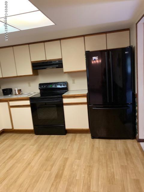1226 Kroucher Road Stroudsburg, PA 18360 - Photo 12 of 28 a kitchen with stainless steel appliances kitchen island wooden cabinets