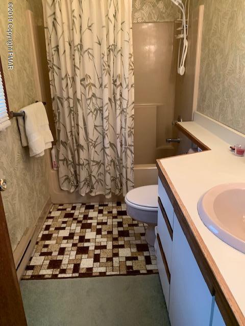 1226 Kroucher Road Stroudsburg, PA 18360 - Photo 18 of 28 a bathroom with a granite countertop sink and a toilet