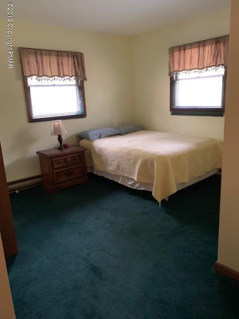 1226 Kroucher Road Stroudsburg, PA 18360 - Photo 19 of 28 a bed sitting in a bedroom next to a window