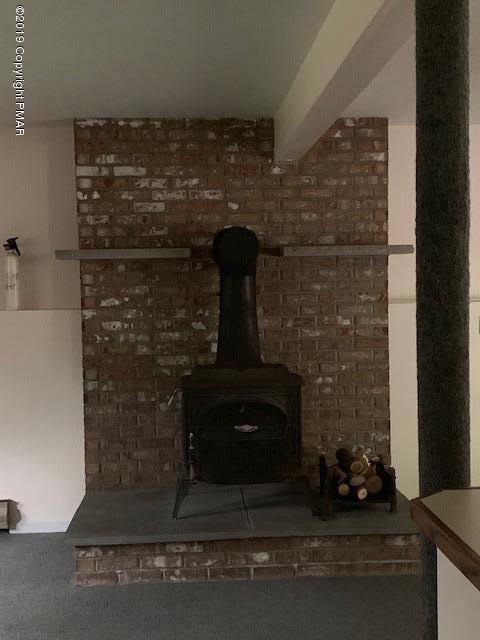 1226 Kroucher Road Stroudsburg, PA 18360 - Photo 24 of 28 a room with a fireplace