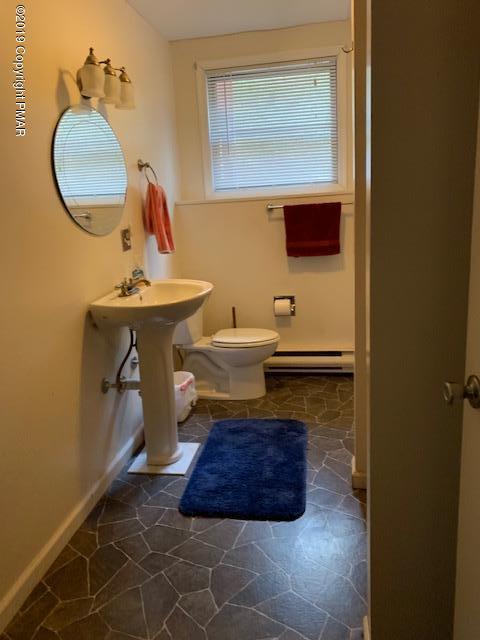 1226 Kroucher Road Stroudsburg, PA 18360 - Photo 25 of 28 a bathroom with a sink and a mirror