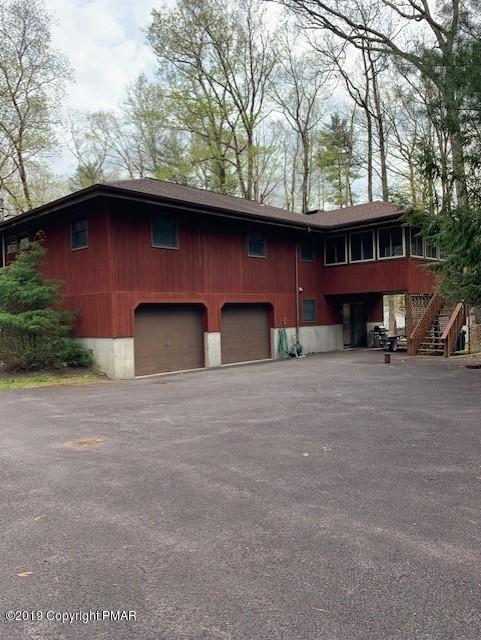 1226 Kroucher Road Stroudsburg, PA 18360 - Photo 3 of 28 a view of a house with a yard and garage