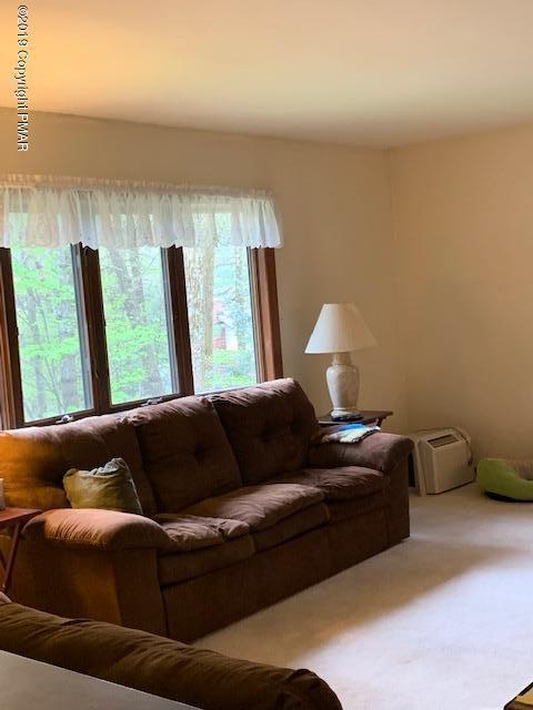 1226 Kroucher Road Stroudsburg, PA 18360 - Photo 7 of 28 a living room with furniture and a large window