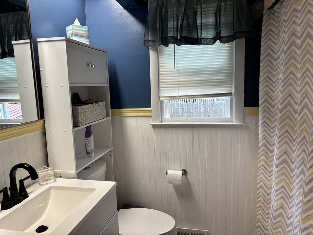 81 Brickett Street Springfield, MA 01119 - Photo 12 of 18 a bathroom with a sink toilet and shower