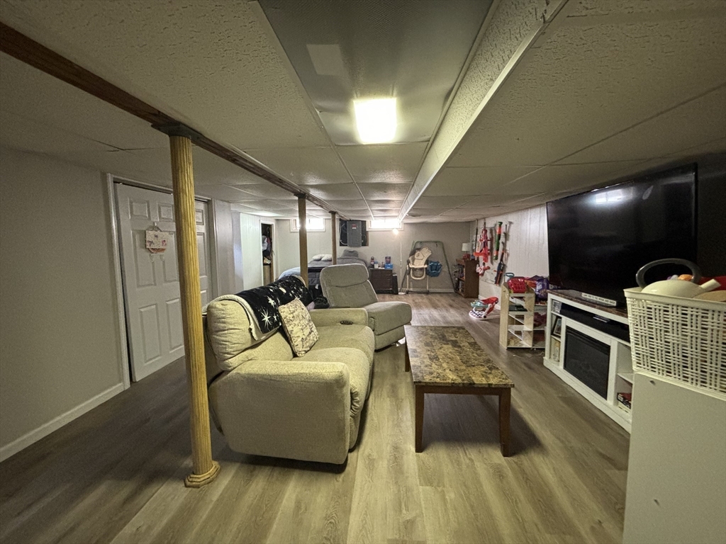 81 Brickett Street Springfield, MA 01119 - Photo 13 of 18 a living room with furniture and a flat screen tv