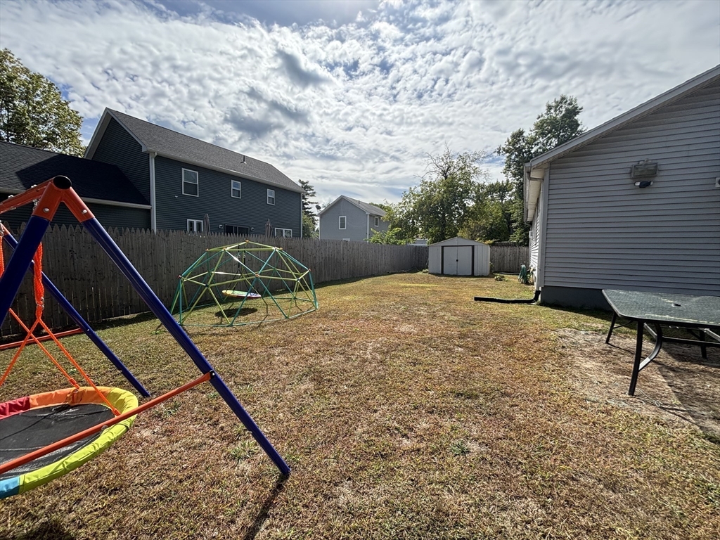 81 Brickett Street Springfield, MA 01119 - Photo 16 of 18 a backyard of a house with seating space