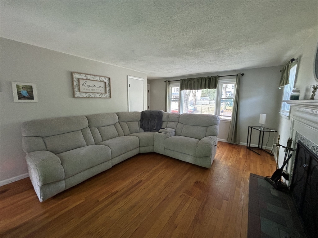 81 Brickett Street Springfield, MA 01119 - Photo 3 of 18 a living room with furniture and a flat screen tv