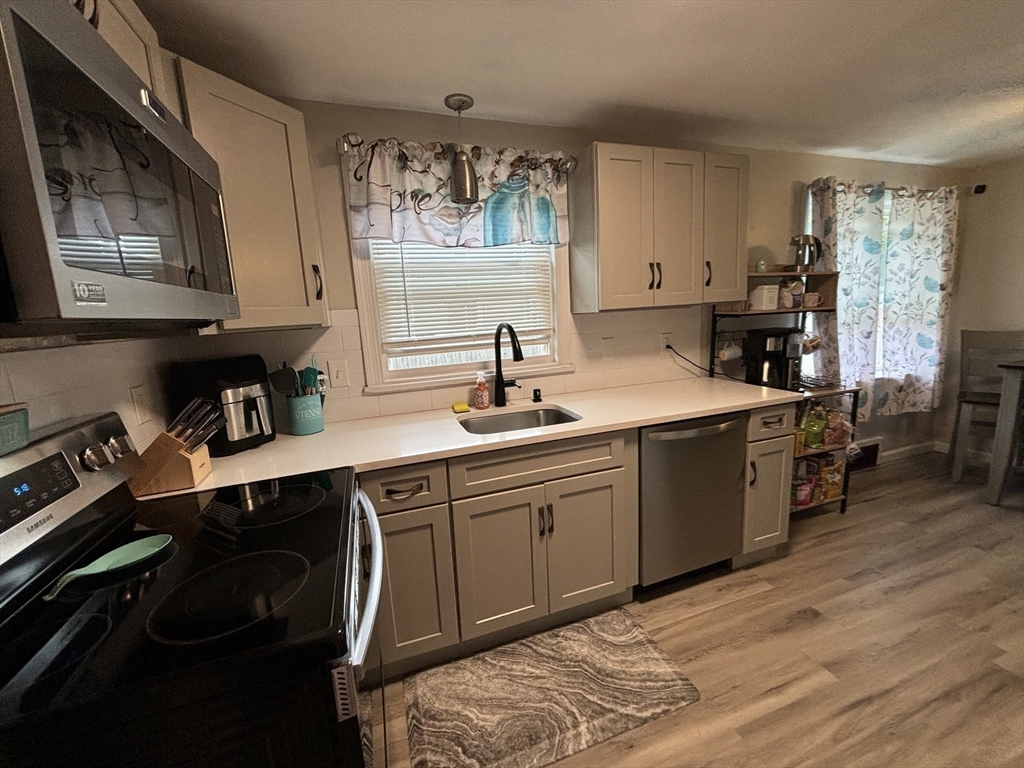 81 Brickett Street Springfield, MA 01119 - Photo 6 of 18 a kitchen with a sink cabinets and wooden floor