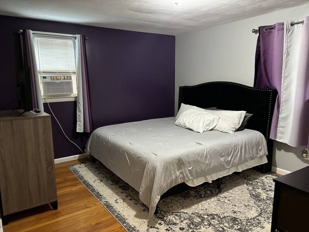 81 Brickett Street Springfield, MA 01119 - Photo 9 of 18 a bedroom with bed and window