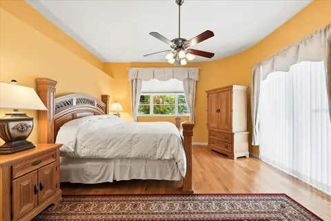 a spacious bathroom with a granite countertop sink a mirror and a