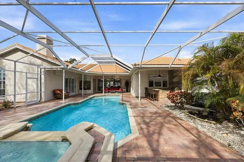 a view of a house with backyard and porch