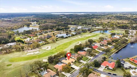 an aerial view of a houses with yard