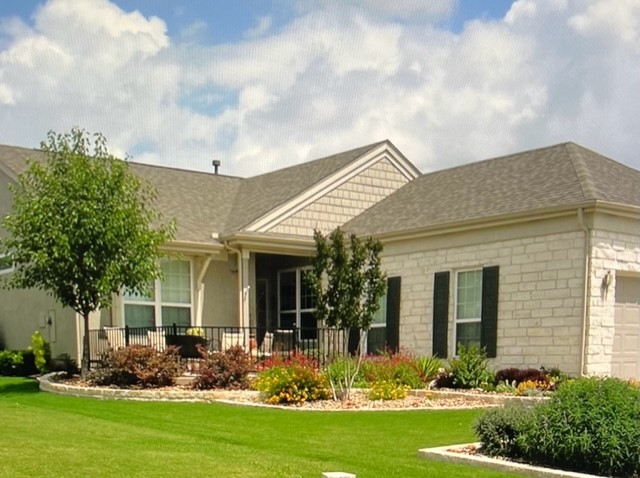 419 Rio Grande Loop Georgetown, TX 78633 - Photo 1 of 1 a front view of a house with garden