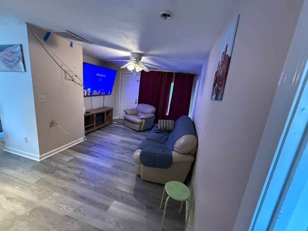 98 School Street Lowell, MA 01854 - Photo 13 of 40 a living room with furniture and a fireplace