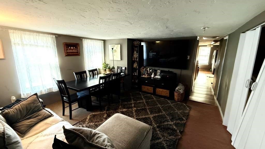 98 School Street Lowell, MA 01854 - Photo 20 of 40 a living room with furniture