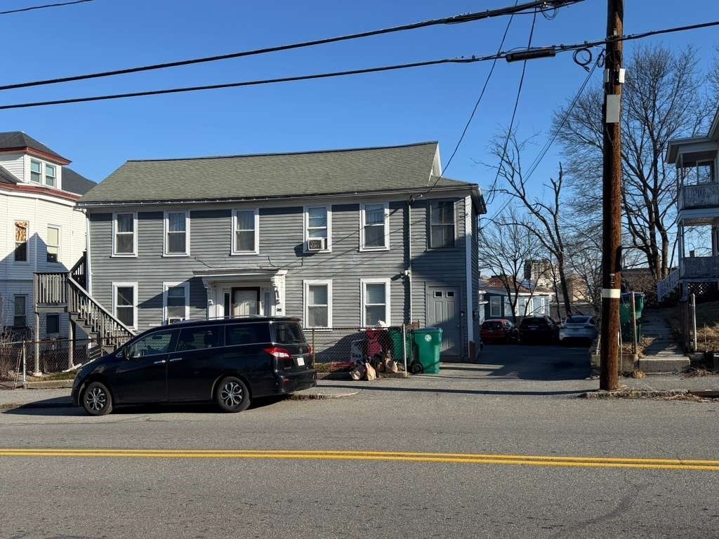 98 School Street Lowell, MA 01854 - Photo 39 of 40 a car parked in front of a house