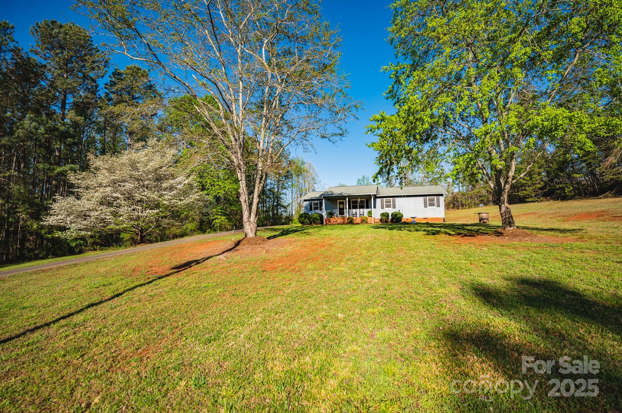 1469 Pearidge Road Bostic, NC 28018 - Photo 11 of 35 a front view of a house with a yard and swimming pool