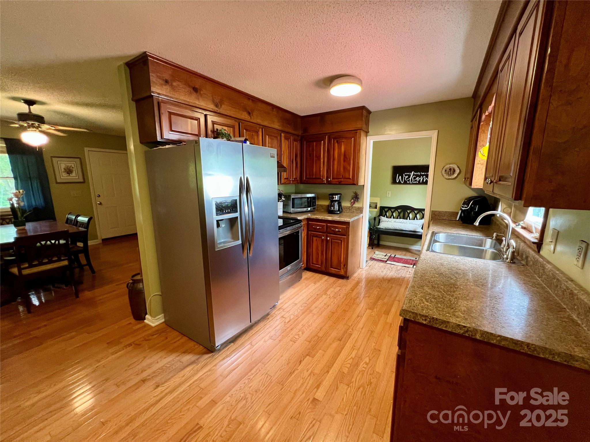 1469 Pearidge Road Bostic, NC 28018 - Photo 20 of 35 a kitchen with stainless steel appliances granite countertop a refrigerator a stove and a sink
