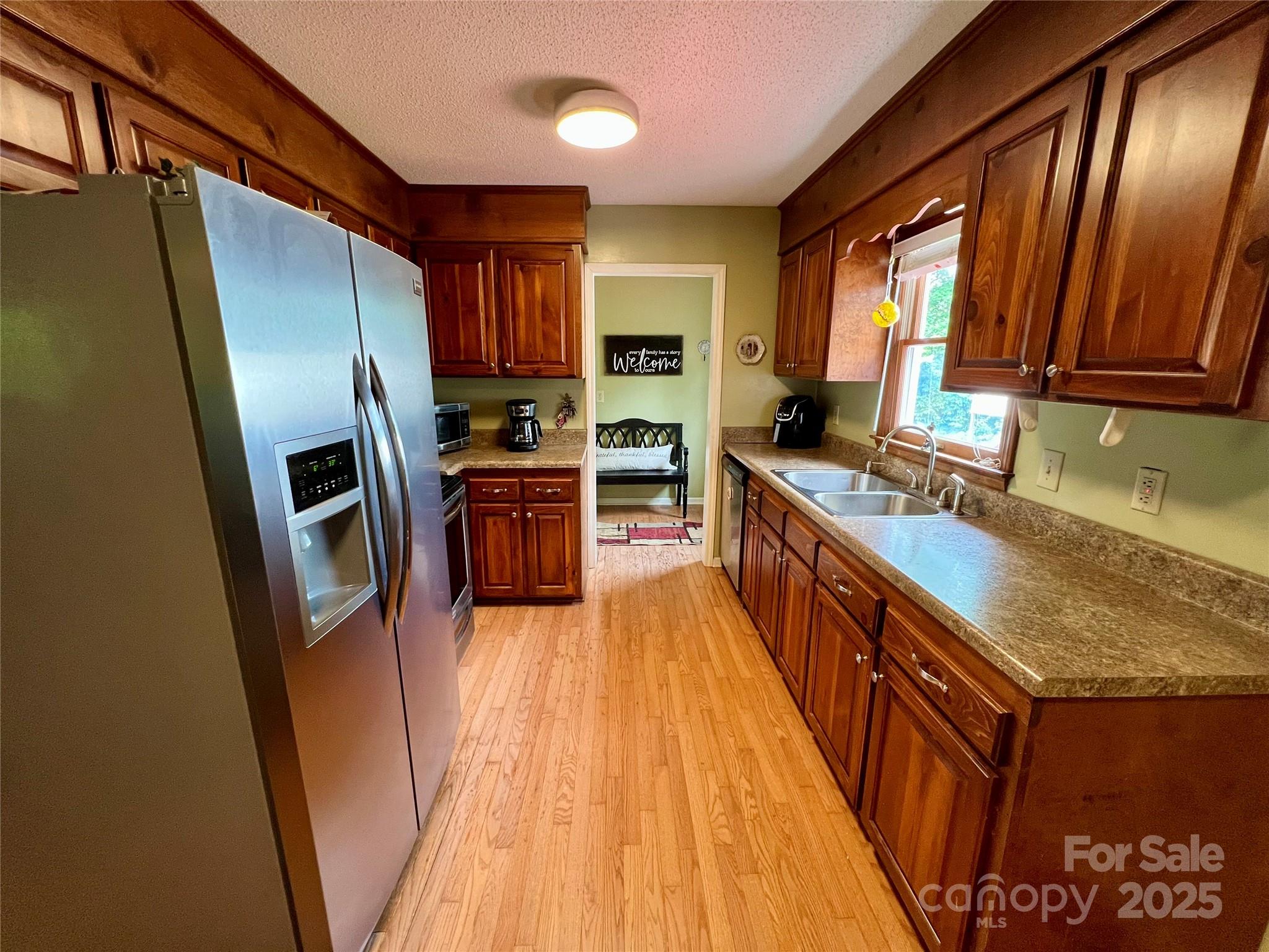 1469 Pearidge Road Bostic, NC 28018 - Photo 21 of 35 a kitchen with stainless steel appliances granite countertop a refrigerator a stove a sink and a microwave