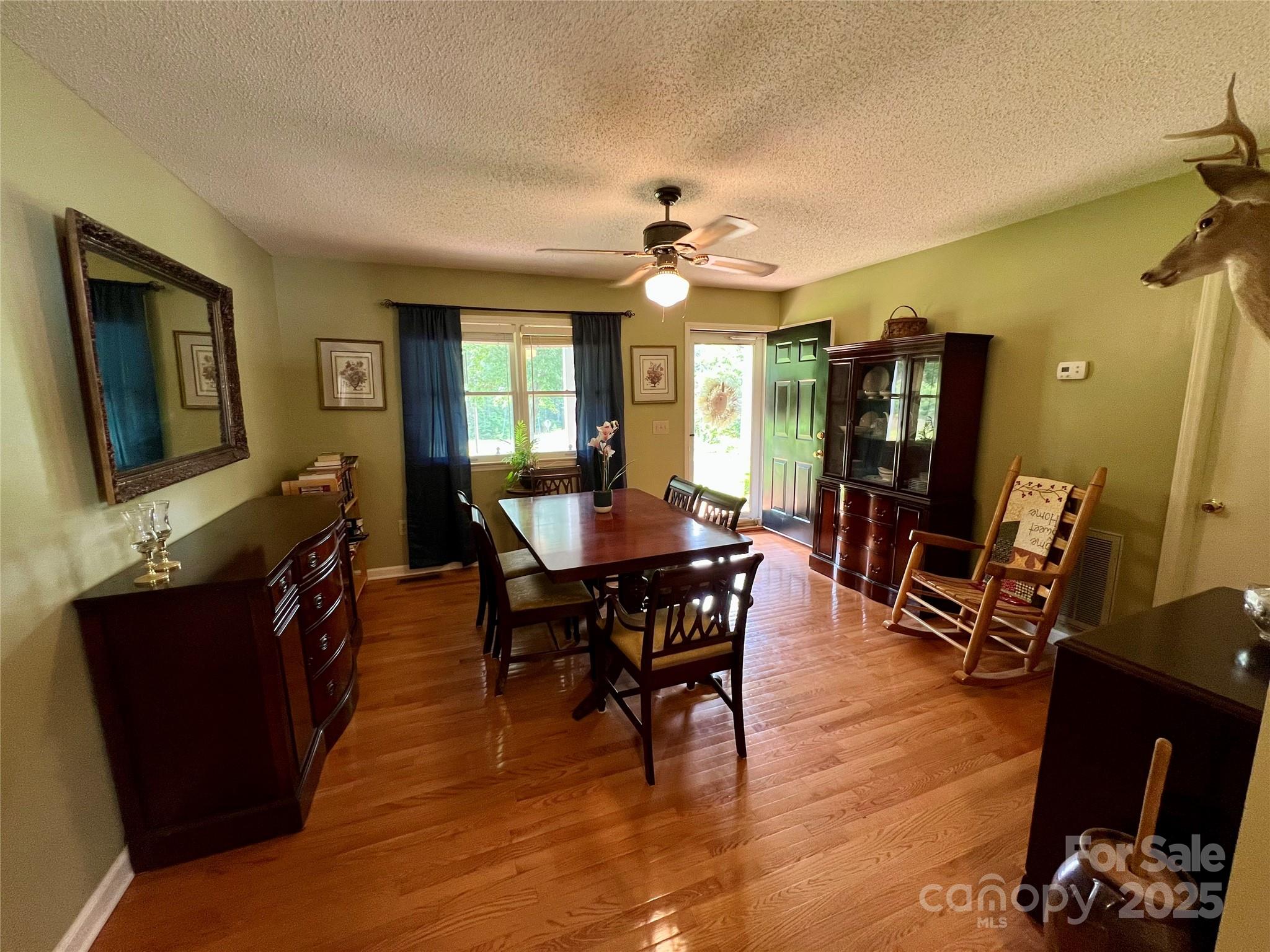 1469 Pearidge Road Bostic, NC 28018 - Photo 23 of 35 a view of a dining room with furniture and wooden floor