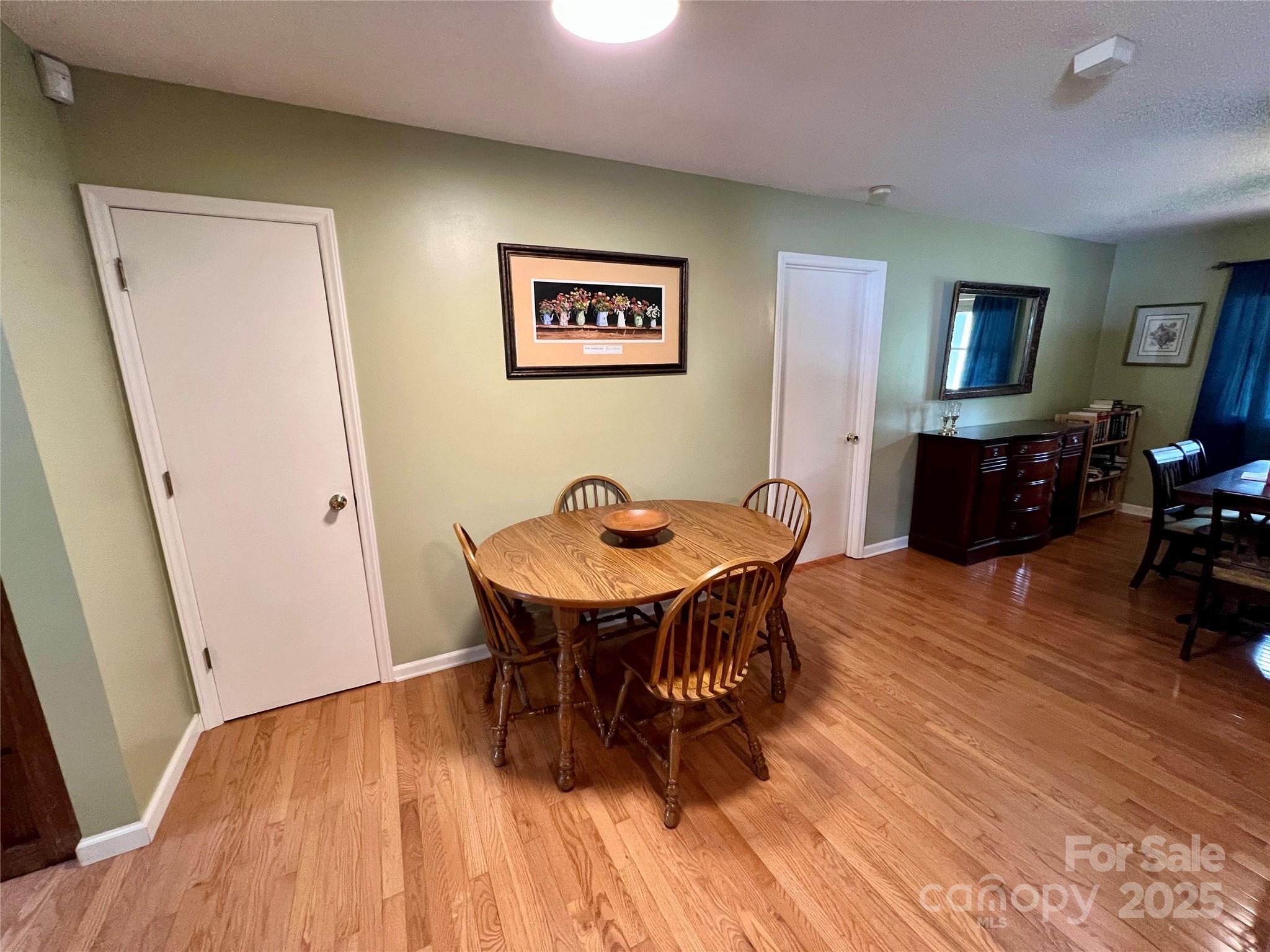 1469 Pearidge Road Bostic, NC 28018 - Photo 24 of 35 a view of a dining room with furniture and wooden floor