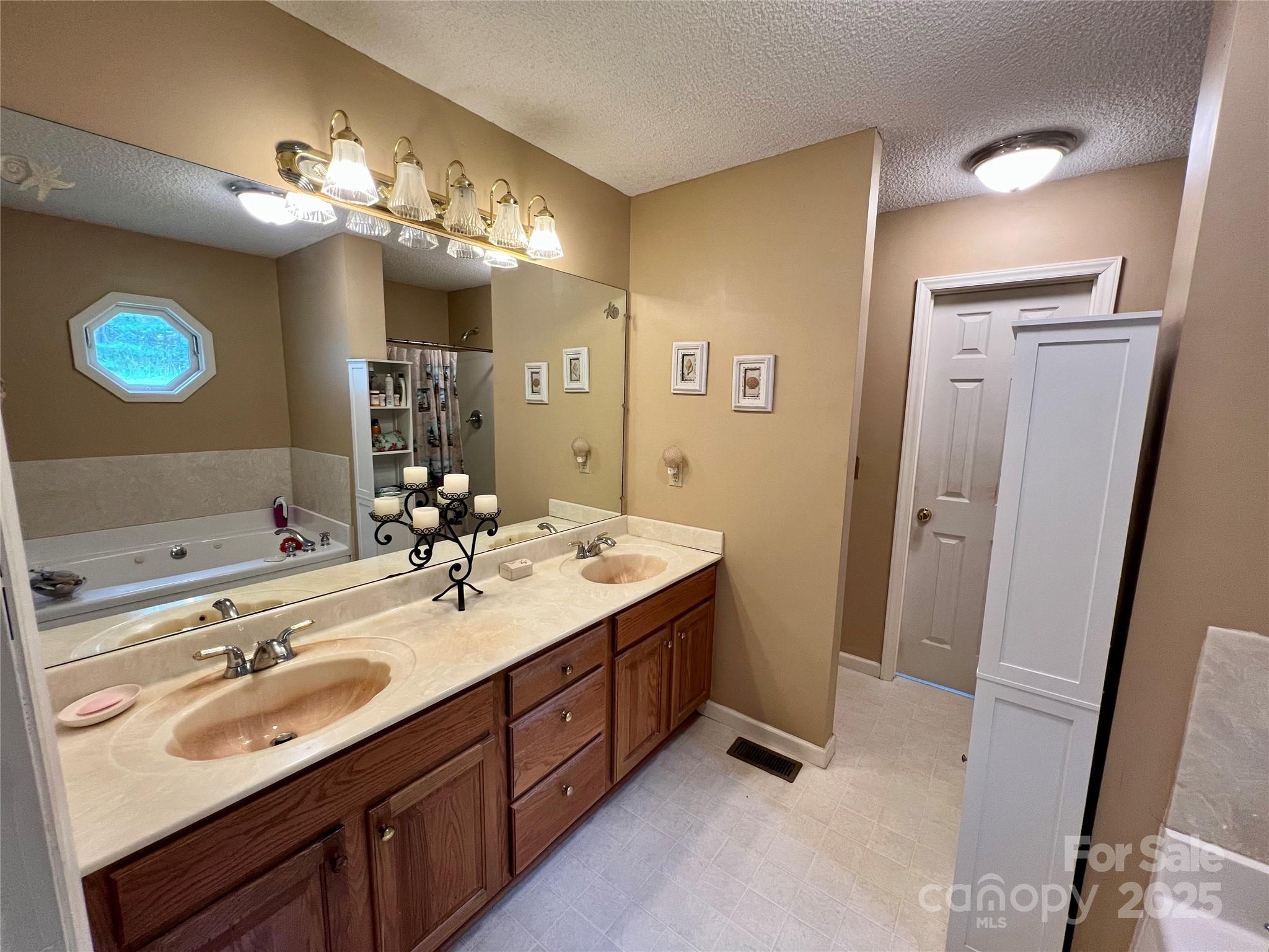 1469 Pearidge Road Bostic, NC 28018 - Photo 30 of 35 a bathroom with a sink vanity and mirror