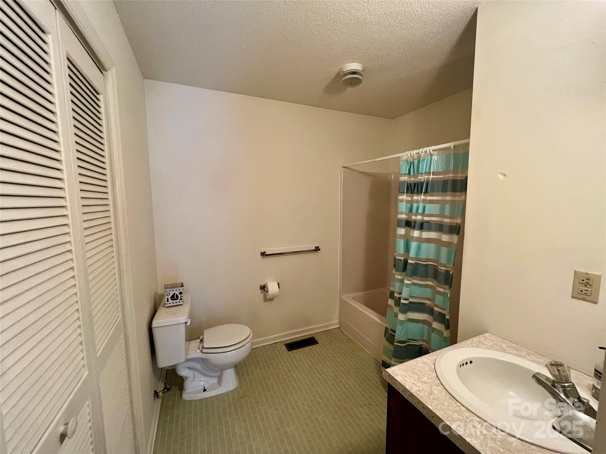 1469 Pearidge Road Bostic, NC 28018 - Photo 35 of 35 a bathroom with a granite countertop sink a toilet and shower