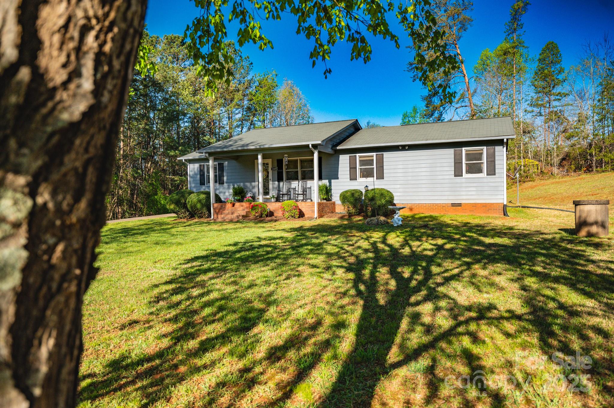 1469 Pearidge Road Bostic, NC 28018 - Photo 9 of 35 a backyard of a house with yard table and chairs