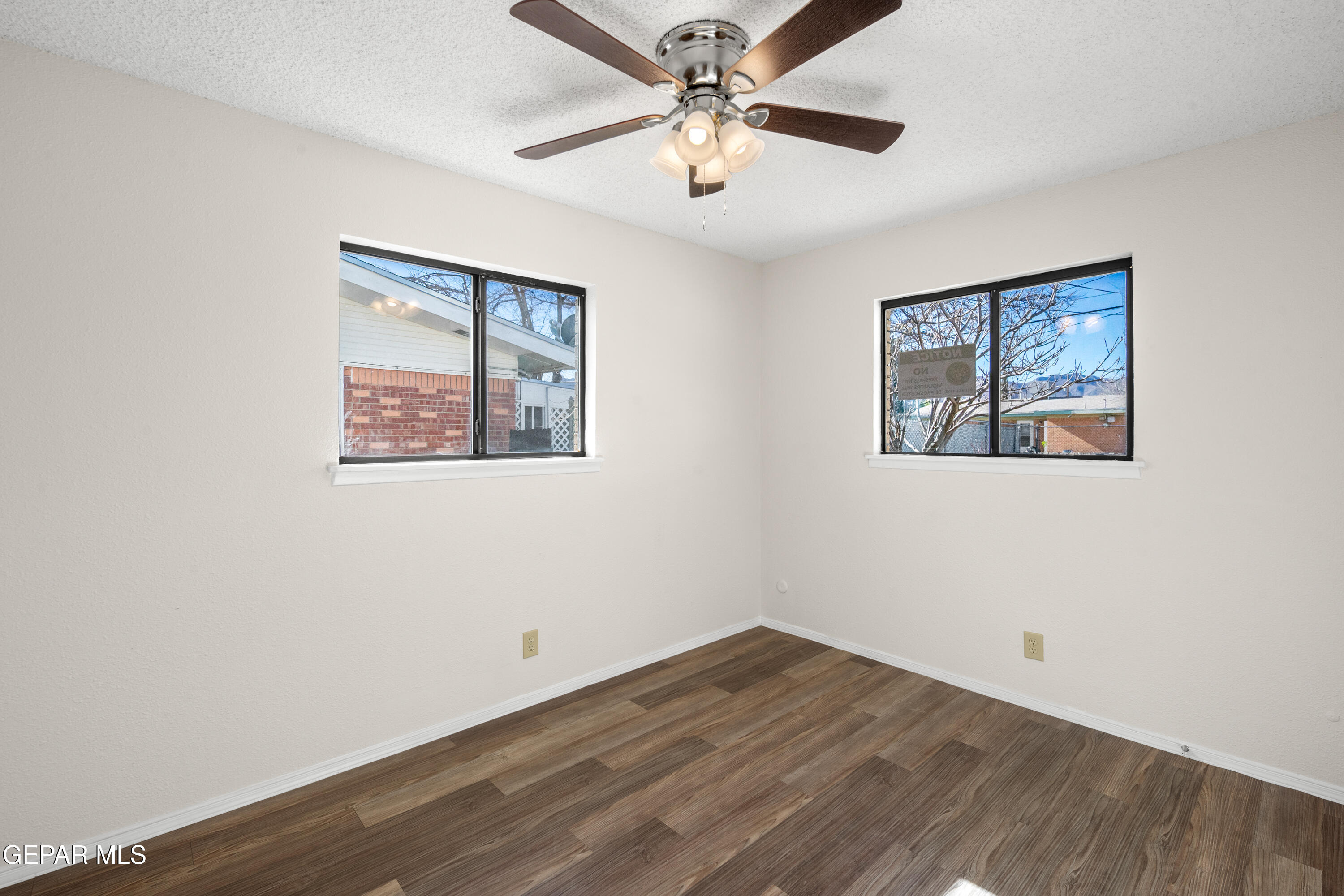 10341 Whyburn Street El Paso, TX 79924 - Photo 12 of 22 a view of an empty room with wooden floor