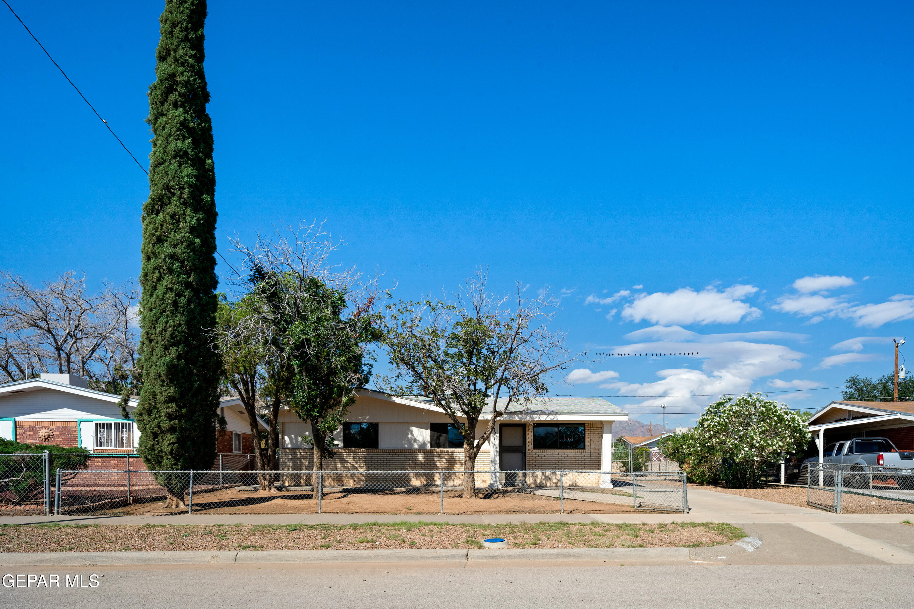 10341 Whyburn Street El Paso, TX 79924 - Photo 2 of 22 a view of road with card board