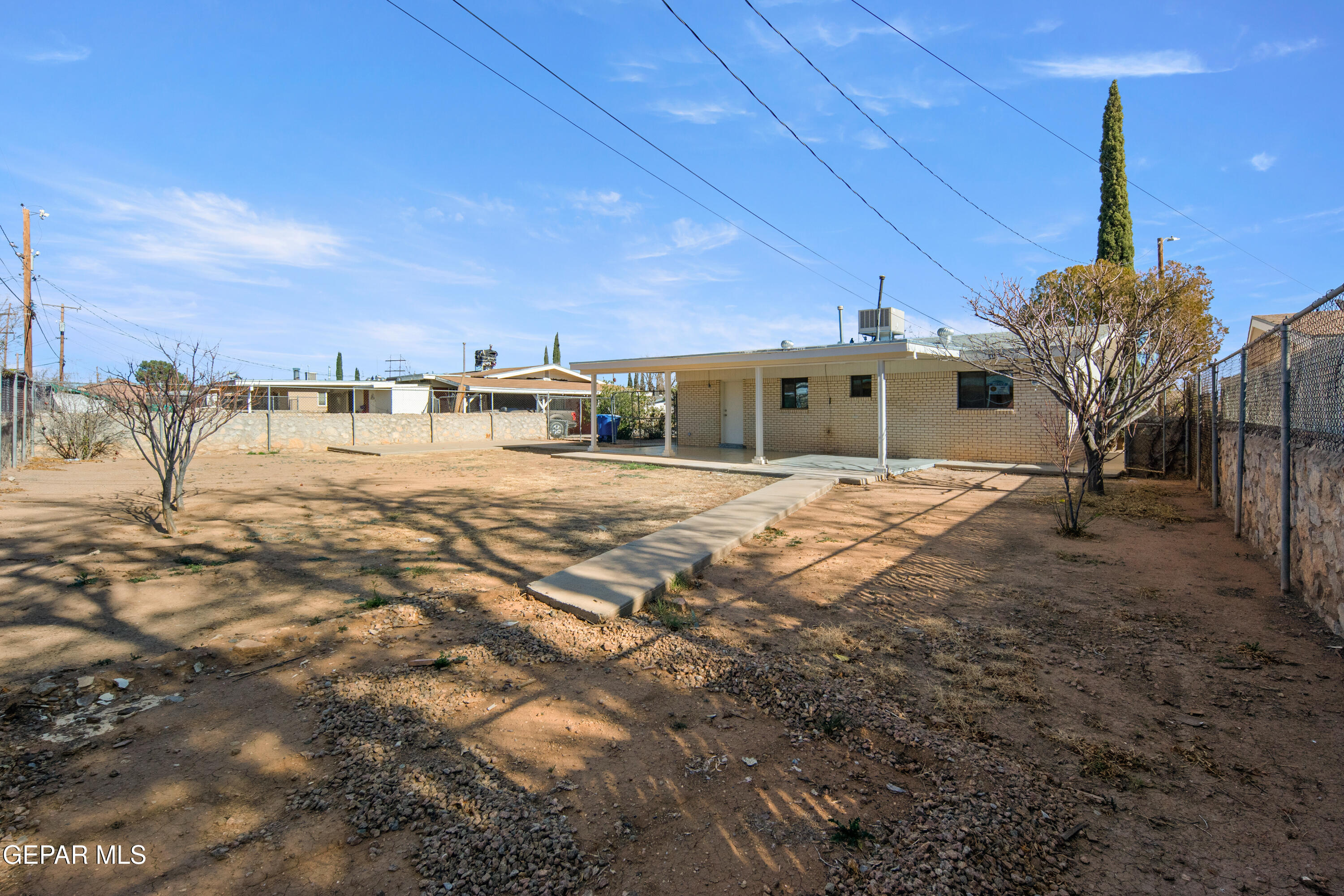 10341 Whyburn Street El Paso, TX 79924 - Photo 21 of 22 a view of a house with a yard