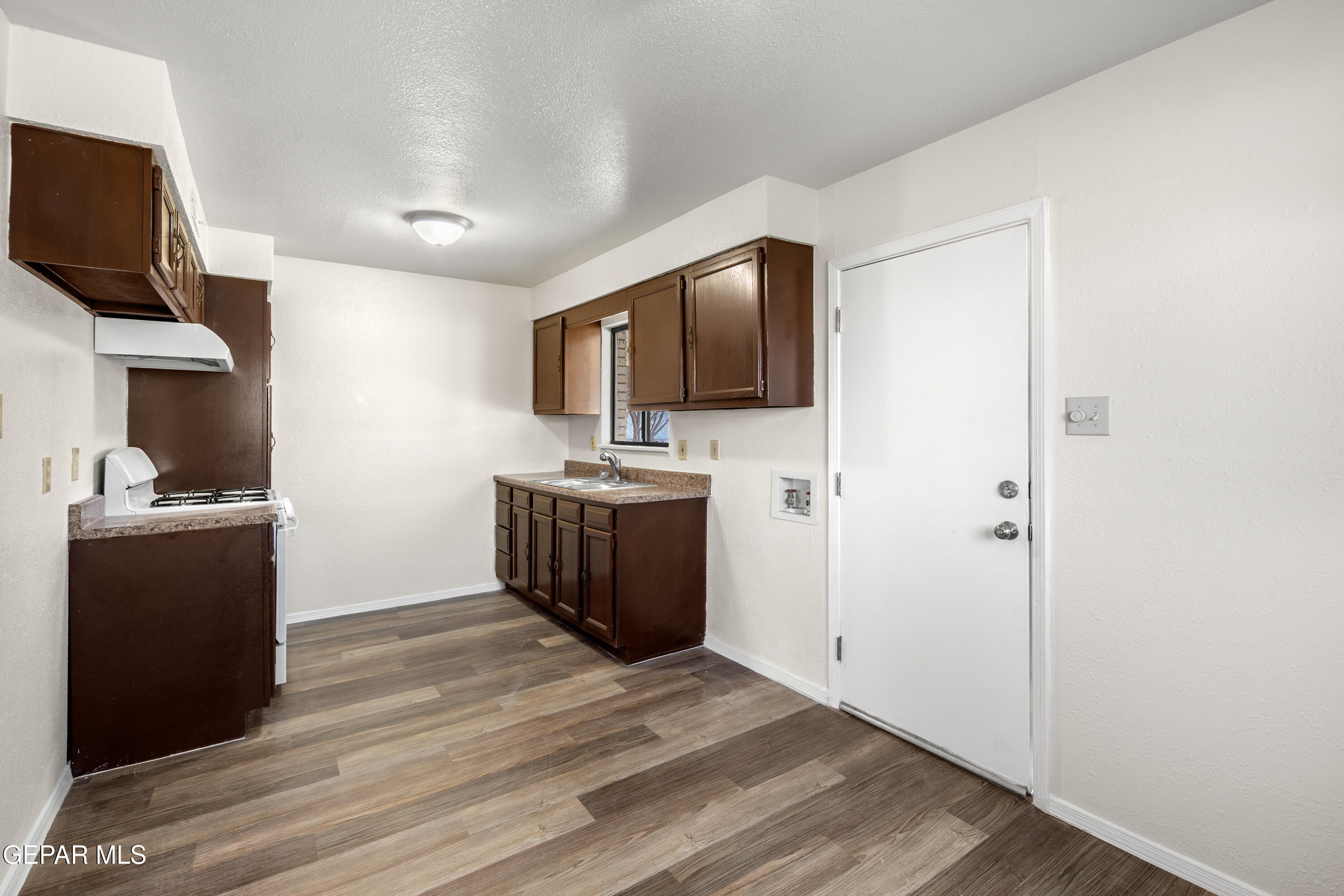 10341 Whyburn Street El Paso, TX 79924 - Photo 8 of 22 a living room with a flat screen tv furniture and a window