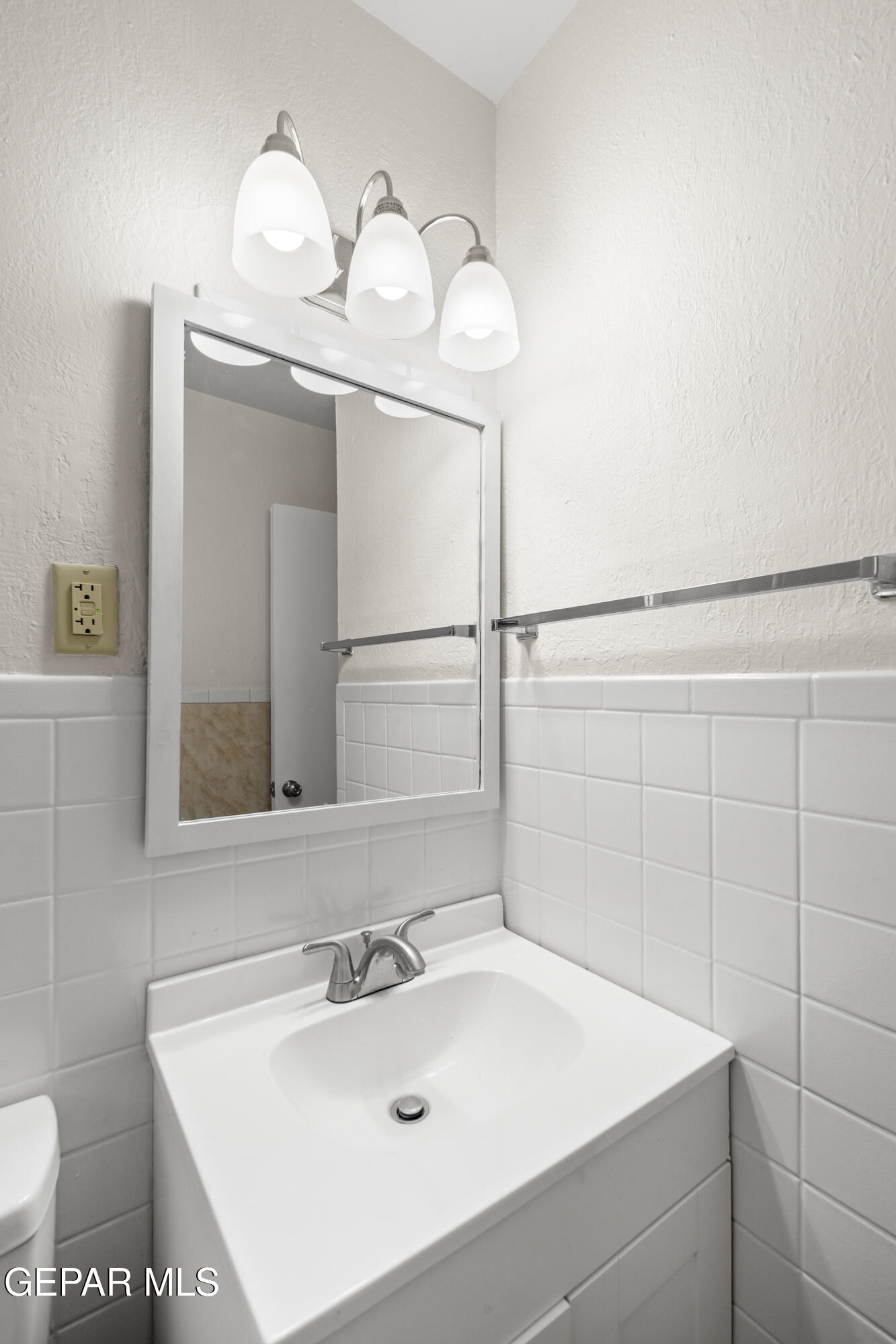10341 Whyburn Street El Paso, TX 79924 - Photo 10 of 22 a bathroom with a sink and mirror