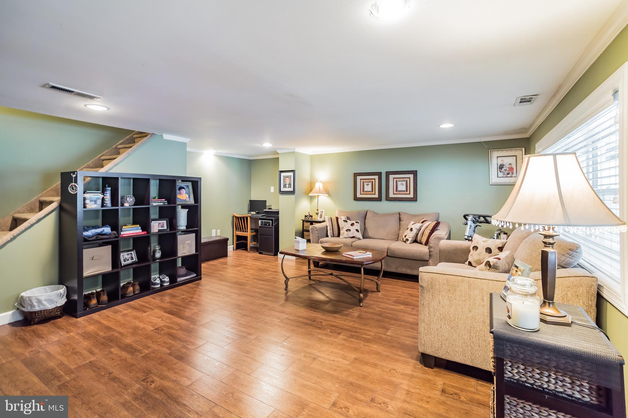 12817 Cabell Road Philadelphia, PA 19154 - Photo 20 of 30 a living room with furniture a window and bookshelf