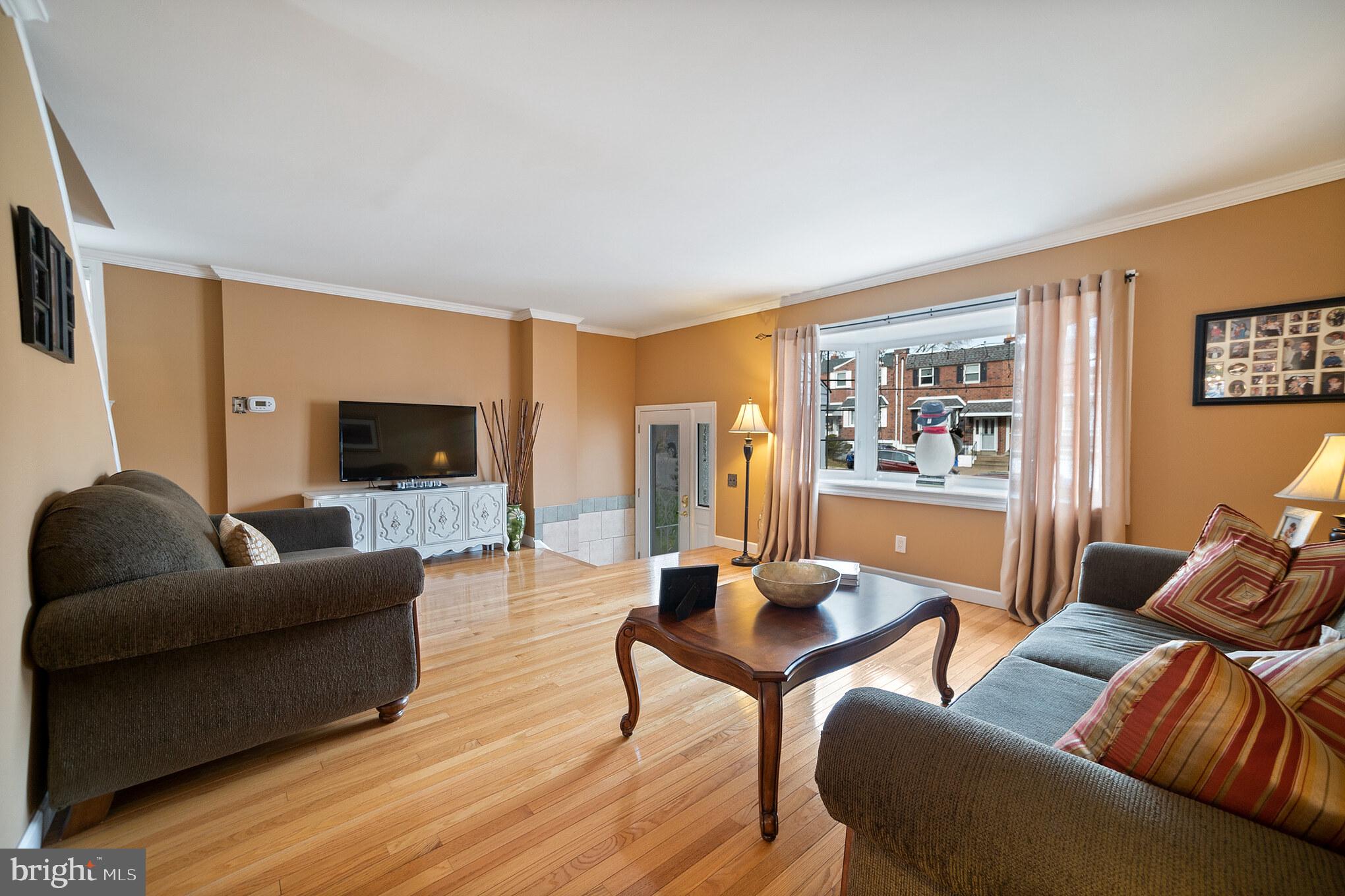 12817 Cabell Road Philadelphia, PA 19154 - Photo 3 of 30 a living room with furniture and a flat screen tv