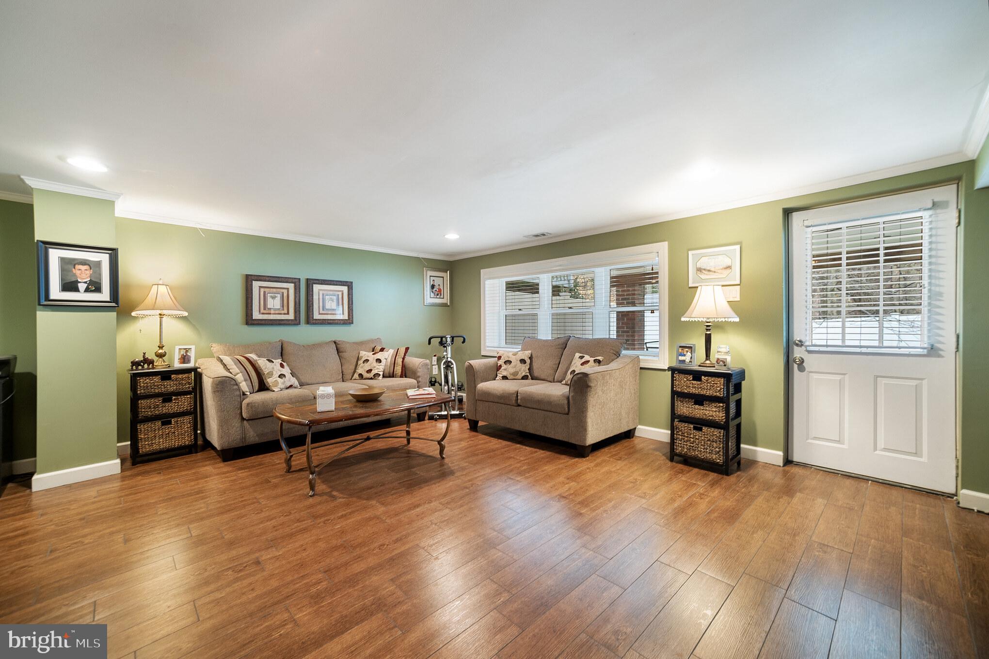 12817 Cabell Road Philadelphia, PA 19154 - Photo 22 of 30 a living room with furniture and a wooden floor