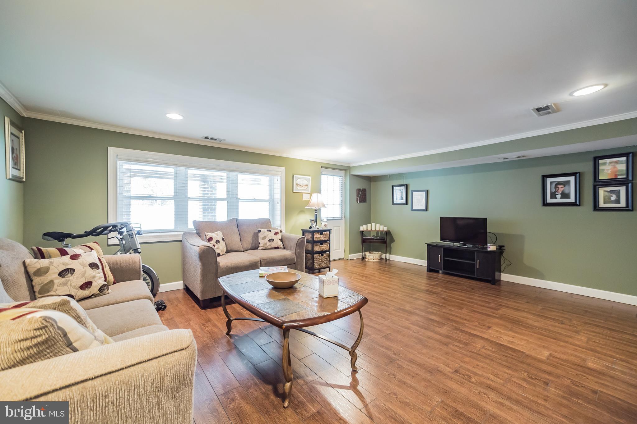 12817 Cabell Road Philadelphia, PA 19154 - Photo 23 of 30 a living room with furniture and a wooden floor