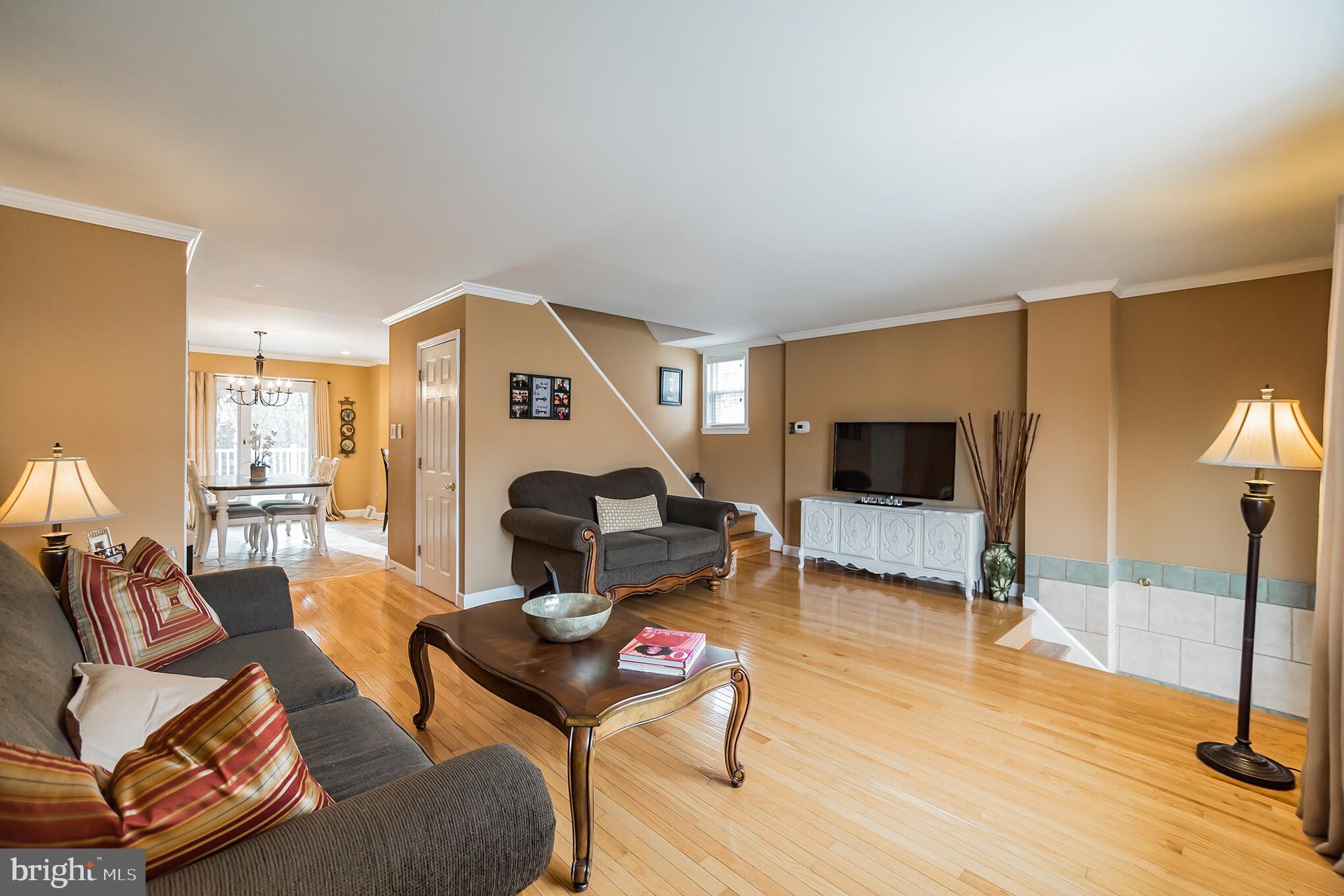 12817 Cabell Road Philadelphia, PA 19154 - Photo 4 of 30 a living room with furniture and a flat screen tv