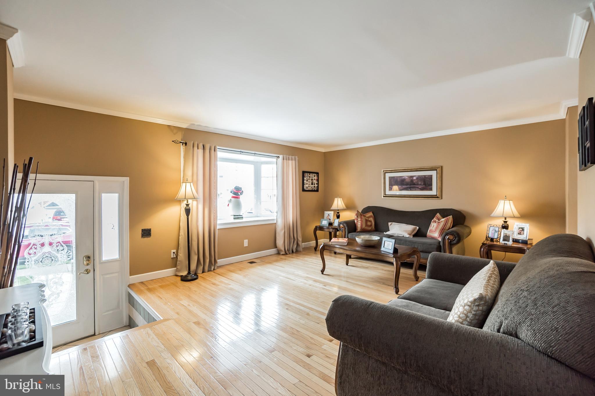12817 Cabell Road Philadelphia, PA 19154 - Photo 5 of 30 a living room with furniture and a wooden floor