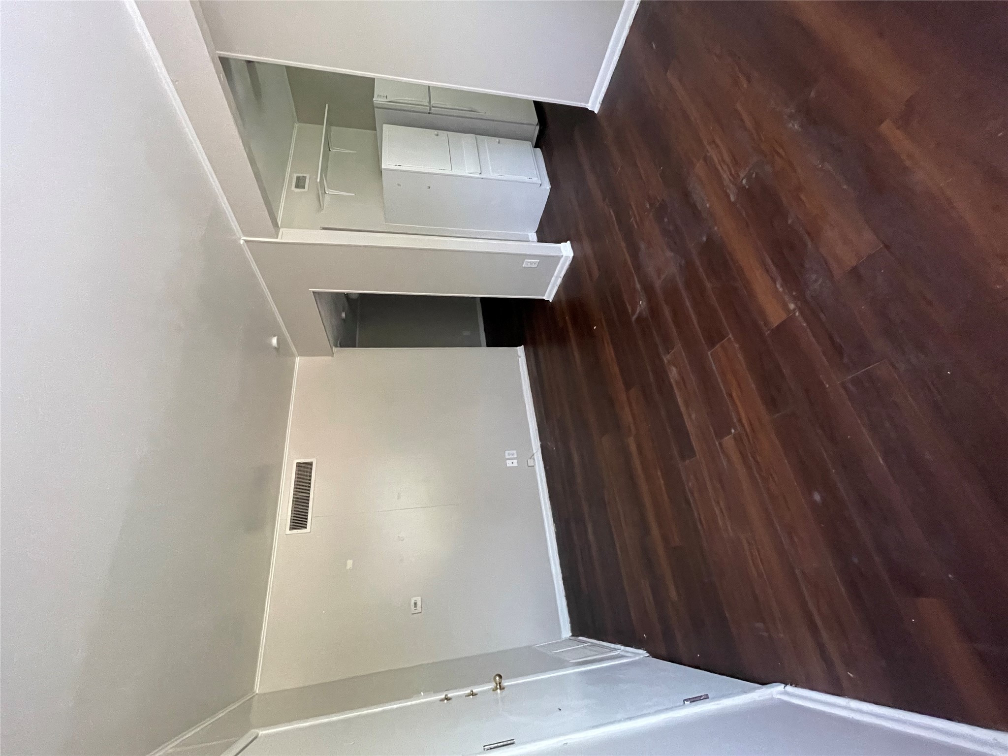 3304 Red River Street, Unit 102 Austin, TX 78705 - Photo 2 of 15 a view of an empty room with wooden floor and a window