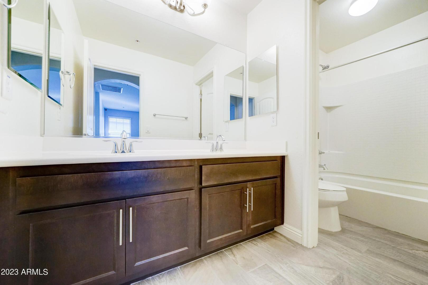 2297 North Alsap Road Buckeye, AZ 85396 - Photo 23 of 36 a bathroom with a sink a toilet and a bathtub