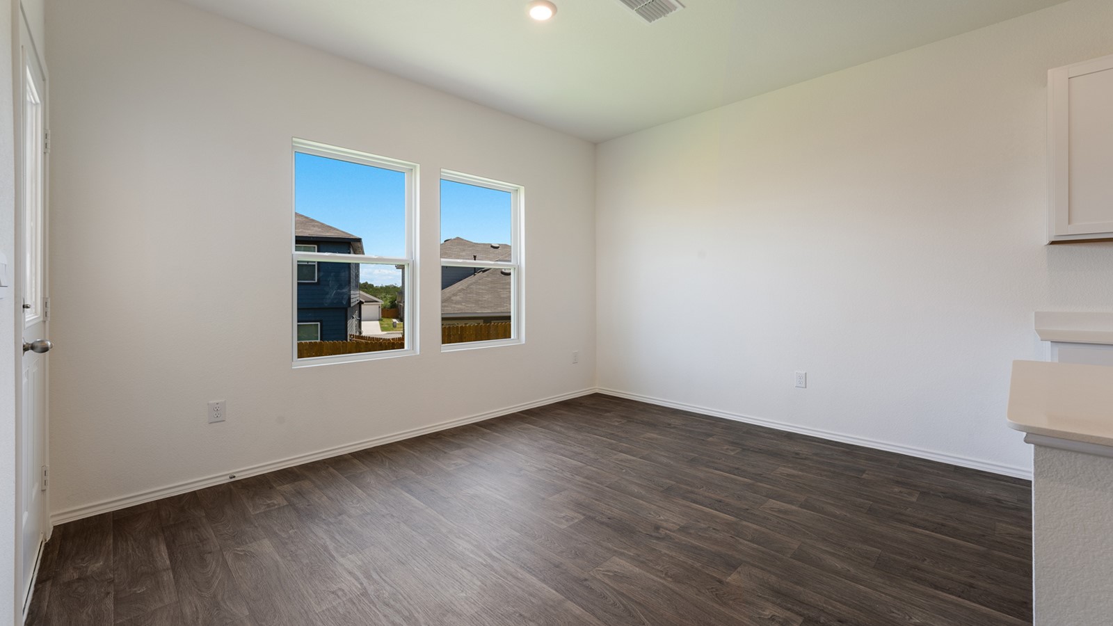 12105 Pike Bend Mustang Ridge, TX 78610 - Photo 11 of 21 a view of an empty room with window and wooden floor