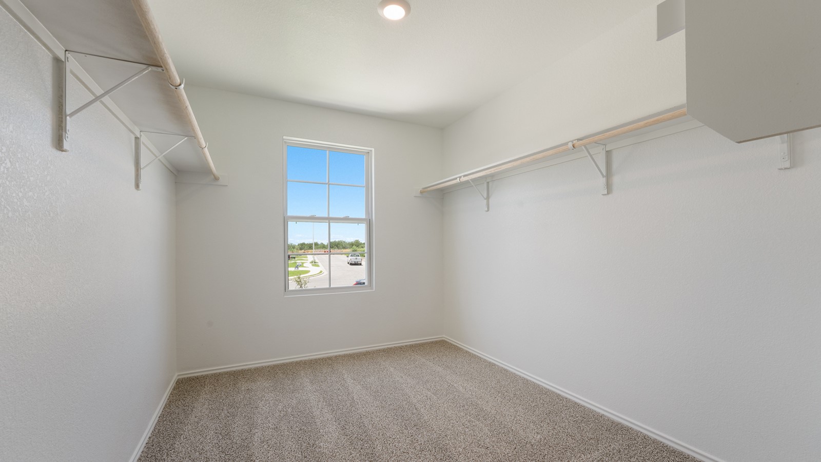 12105 Pike Bend Mustang Ridge, TX 78610 - Photo 15 of 21 a view of an empty room with a window and closet