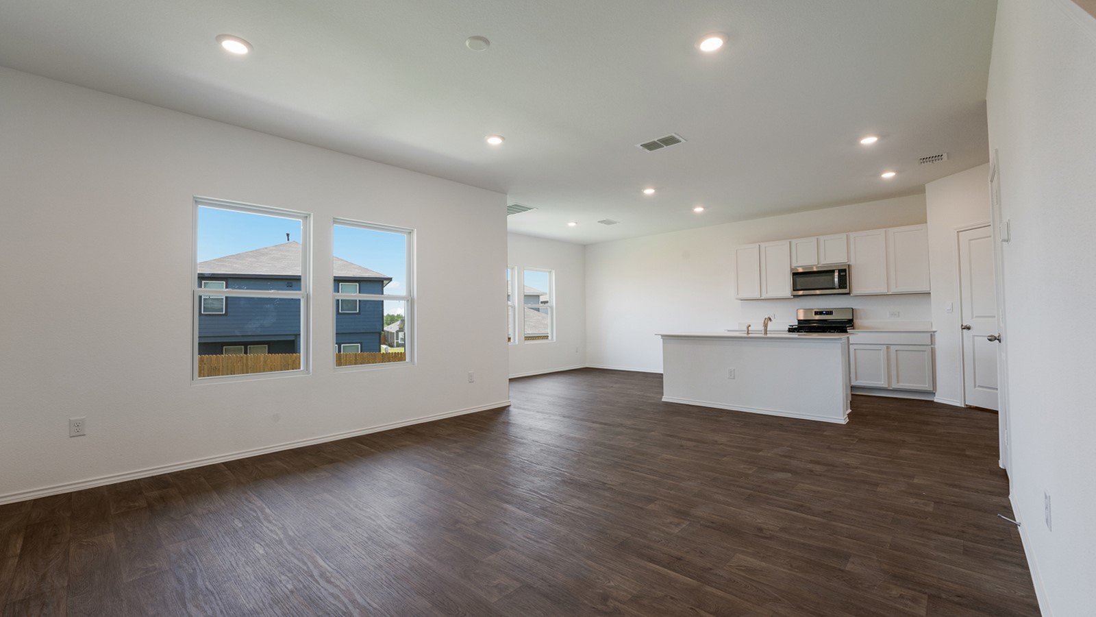 12105 Pike Bend Mustang Ridge, TX 78610 - Photo 3 of 21 a view of kitchen with granite countertop stainless steel appliances refrigerator sink and cabinets