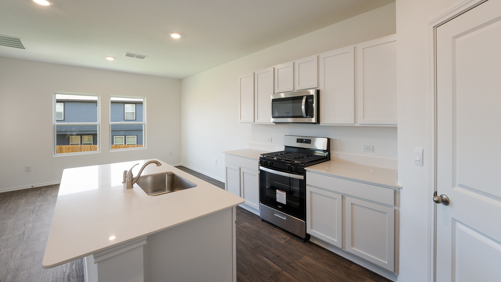 12105 Pike Bend Mustang Ridge, TX 78610 - Photo 9 of 21 a kitchen that has a sink and a stove top oven